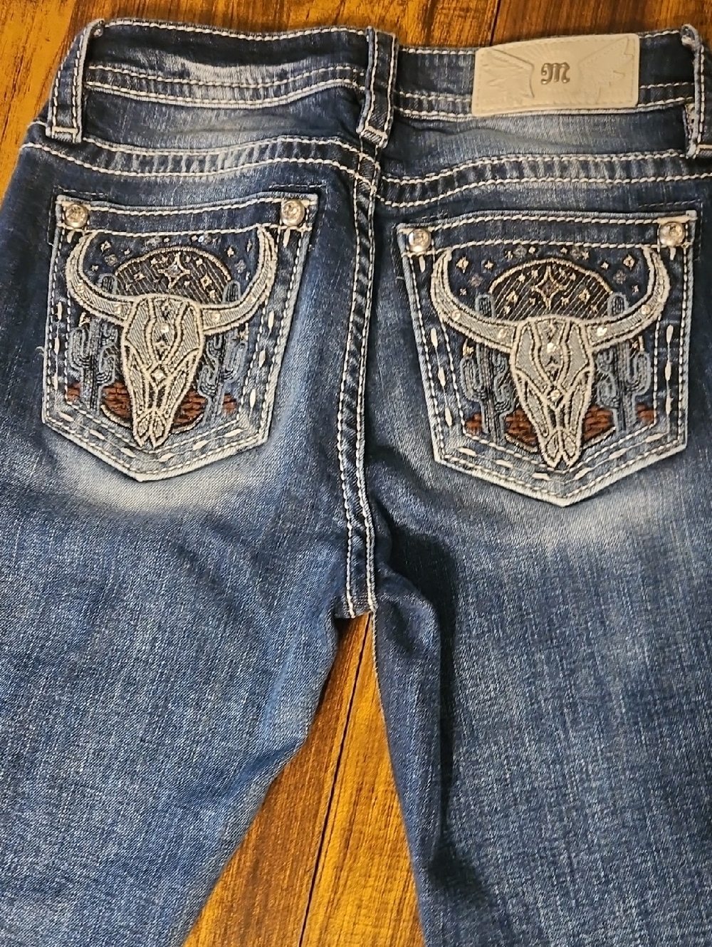Miss Me Blue Denim Jeans with Embroidered Bull Skull Pockets